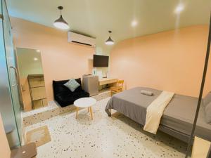 a bedroom with a bed and a desk and a chair at Q apaz Serviced Apartment - 45TL in Ho Chi Minh City