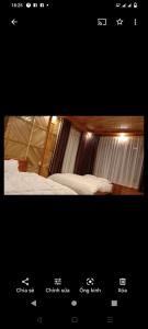 a screenshot of a video of a bedroom with a bed at La Bằng Homestay in Lá Cam