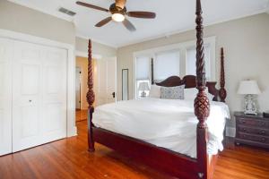 a bedroom with a bed and a ceiling fan at The Big Sanchez in St. Augustine