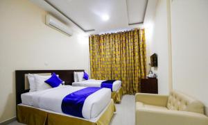 Postel nebo postele na pokoji v ubytování SH Hotel