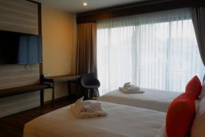 Llit o llits en una habitació de Na Napa Wellness Spa & Resort