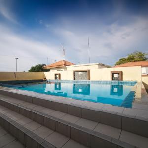 a swimming pool on the roof of a building at Putatan Platinum Apartment with Pool in Kota Kinabalu