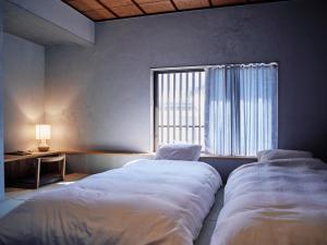 เตียงในห้องที่ 小鳩屋