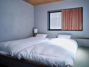 เตียงในห้องที่ 小鳩屋