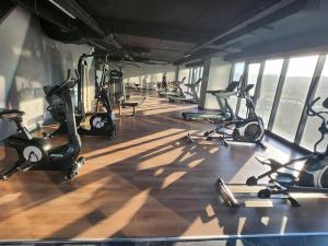 a gym with a bunch of exercise bikes in a room at Brand & Luxurious Suite near- Mall of Istanbul in Istanbul