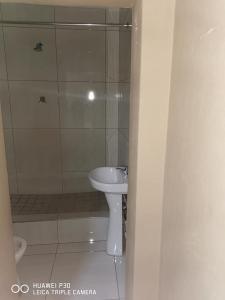 a bathroom with a sink and a toilet and a shower at Kpt property investment in Soweto