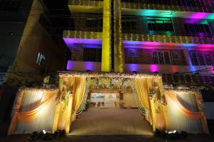 an entrance to a building with curtains and lights at LOTUS HOTEL AND BANQUET in Kolkata