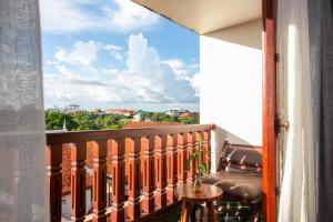 a balcony with a view of a city at Mera Residence in Siem Reap