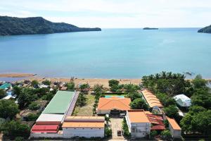 an aerial view of a resort with the water at RSAM Beach Resort by Cocotel in Nasugbu