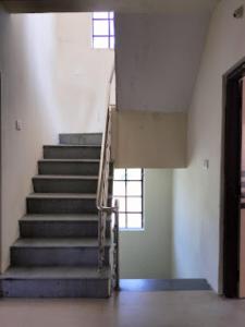 een trap in een gebouw met een trap bij Two Brother's Hotel lodging And Restaurant WARDHA in Wardha