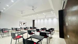 a room with a bunch of chairs and tables at BluO Studio3 DLF Cybercity - Balcony, Gym TT, Lift in Gurgaon
