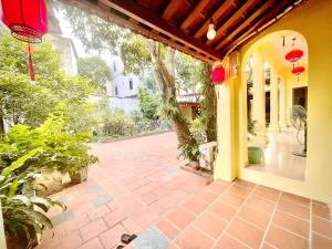 an outside view of a house with a patio at Lee Homestay in Hanoi +152 photos