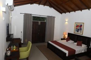 Postel nebo postele na pokoji v ubytování Hotel Ro Kalawewa + 37 fotografií