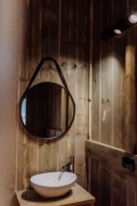 a bathroom with a white sink and a mirror at Scamander Sanctuary Holiday Park in Scamander