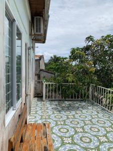 a balcony of a house with a tiled floor at ISLAND HOMESTAY TIỀN GIANG in Ấp Tân An Thi