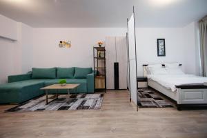 En eller flere senge i et værelse på L&V Family Studio