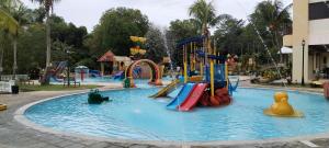 a water park with slides and rides in it at Amverton Heritage Resort in Melaka