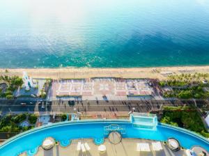 an aerial view of a beach and a swimming pool at JK.Boutique Oceanfront Panorama Residence in Nha Trang