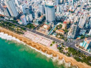 an aerial view of a city and the ocean at JK.Boutique Oceanfront Panorama Residence in Nha Trang