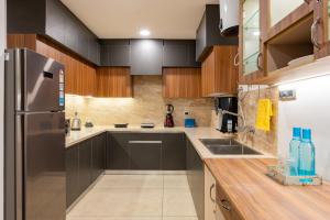 Virtuvė arba virtuvėlė apgyvendinimo įstaigoje BnBBuddy Case Vacanze at Cliffton Valley Shimla