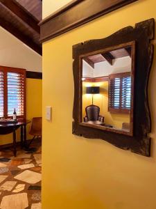 a mirror on the wall of a room at The Gamekeepers Spa Cottage in Tamborine Mountain in Mount Tamborine