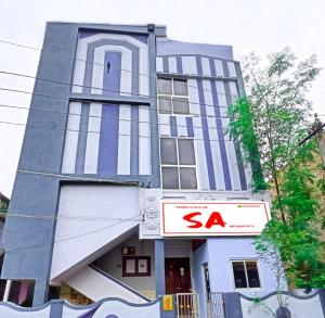 a building with a sa sign in front of it at THIRUNALLAR S A RESIDENCY in Tirunallār +50 photos
