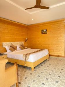 a bedroom with a bed and a ceiling fan at Grace Exotica Goa in Canaguinim