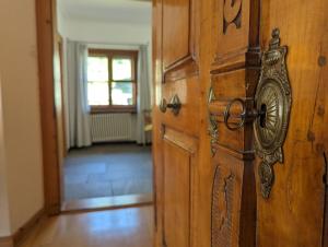 a close up of a wooden door in a room at Villa Bochert in Zuoz