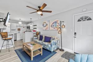 a living room with a couch and a table at Flagler Suites 2 in New Smyrna Beach