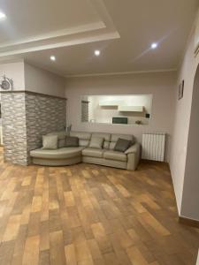 a living room with a couch and a fireplace at Domus Melius in Castellammare di Stabia