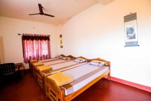 Postel nebo postele na pokoji v ubytování Uttunga Homestay