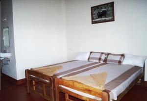Postel nebo postele na pokoji v ubytování Uttunga Homestay + 1 fotografie