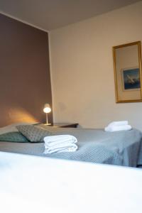 Postel nebo postele na pokoji v ubytování Frederiksværk Hotel