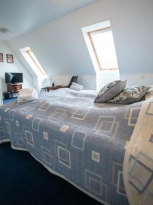 Postel nebo postele na pokoji v ubytování Frederiksværk Hotel