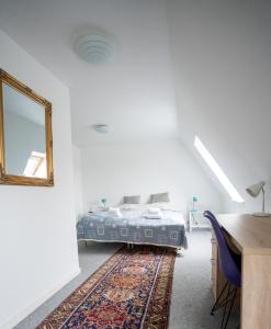 Postel nebo postele na pokoji v ubytování Frederiksværk Hotel