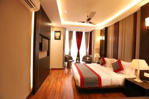 Rúm í herbergi á Hotel The Magic Tree - Paharganj New Delhi