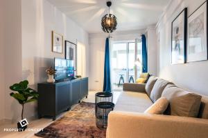 a living room with a couch and a tv at Central Residence Apartment 505 in Bucharest
