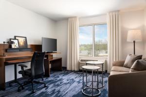 a hotel room with a desk and a computer at Fairfield Inn & Suites by Marriott Akron Fairlawn in Montrose