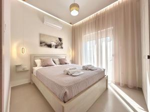 Postel nebo postele na pokoji v ubytování Seaside Deluxe Apartment