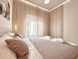 Postel nebo postele na pokoji v ubytování Seaside Deluxe Apartment