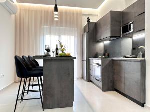 Kuchyň nebo kuchyňský kout v ubytování Seaside Deluxe Apartment + 31 fotografií