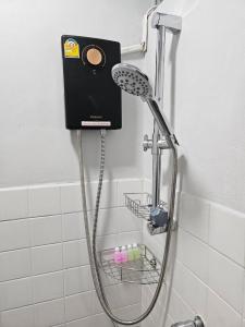 a shower with a shower head in a bathroom at Hommie by De-A-Ga in Ban Bang Talat +118 photos