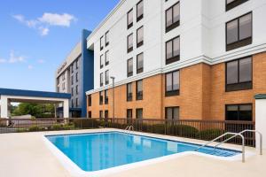 an image of a swimming pool in front of a building at Hampton Inn & Suites Valley Forge/Oaks in Phoenixville