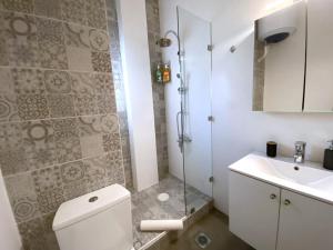 a bathroom with a shower and a toilet and a sink at MediTerra Stay in the heart of Athens in Athens