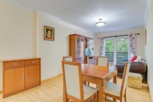 a kitchen and dining room with a table and chairs at Isabel Apartment by Holiday Rental Madeira in Ribeira Brava +18 photos
