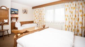 Letto o letti in una camera di Gasthof Talblick