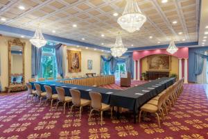 a large conference room with a long table and chairs at Safety Harbor Resort & Spa Trademark Collection by Wyndham in Safety Harbor +81 photos