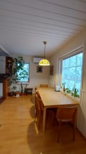 a dining room with a table and chairs in a room at Villa SinettäStar-- Traditional Lapland Chalet in Rovaniemi