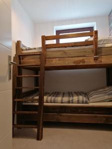 a couple of bunk beds in a room at Haus Sonnenkur in Heusweiler