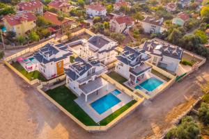 an aerial view of a large house with a swimming pool at Villa Sherbella in Fethiye